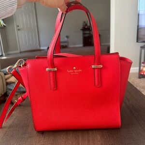 Red Kate spade bag strap included with gold hardware